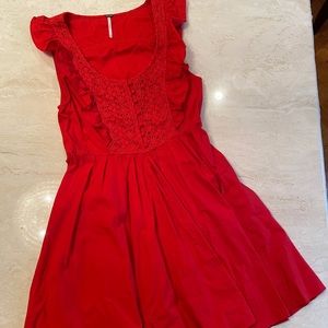 Red dress. Ruffled top. Pockets and side zipper.